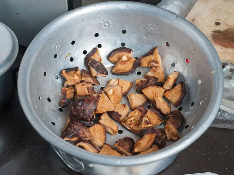 shiitake mushrooms in a strainer